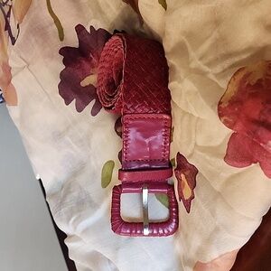 Leather magenta woven belt.